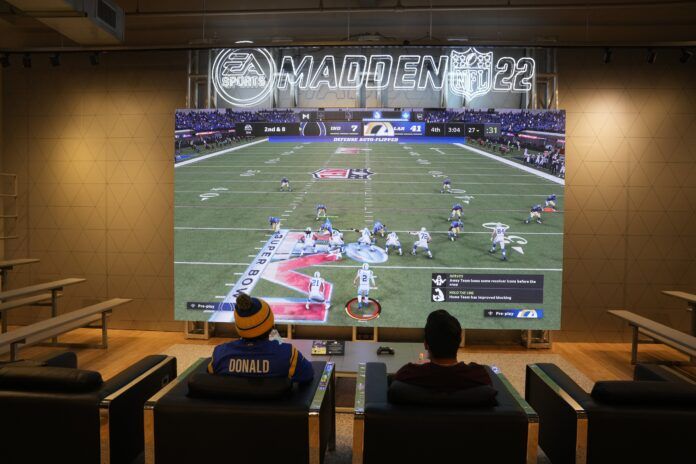 Playing the Madden 24 NFL video game.