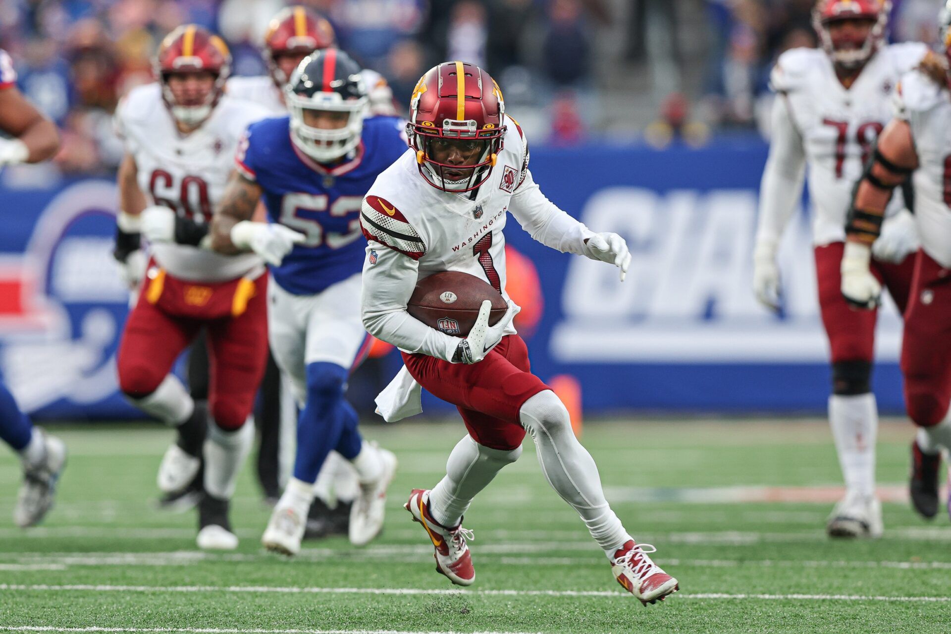 Washington Commanders wide receiver Jahan Dotson (1) runs up field on a touchdown reception.