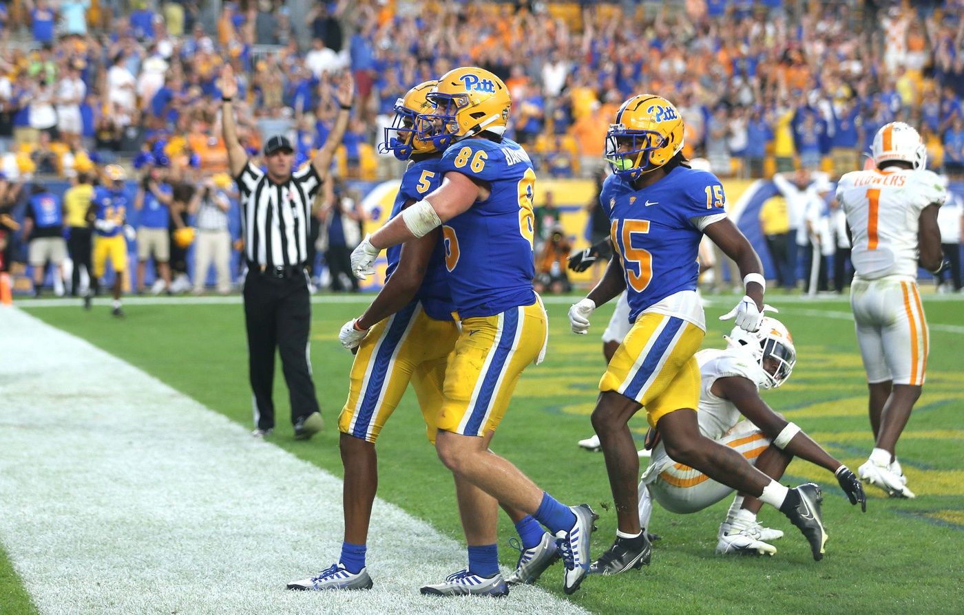 Several Pittsburgh Panthers celebrate after scoring a touchdown.