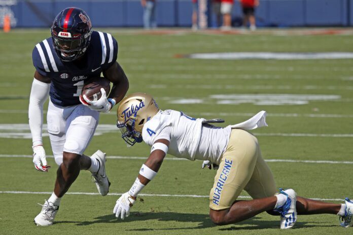 Ole Miss WR Jonathan Mingo (1) runs after a catch against the Tulsa Golden Hurricane.