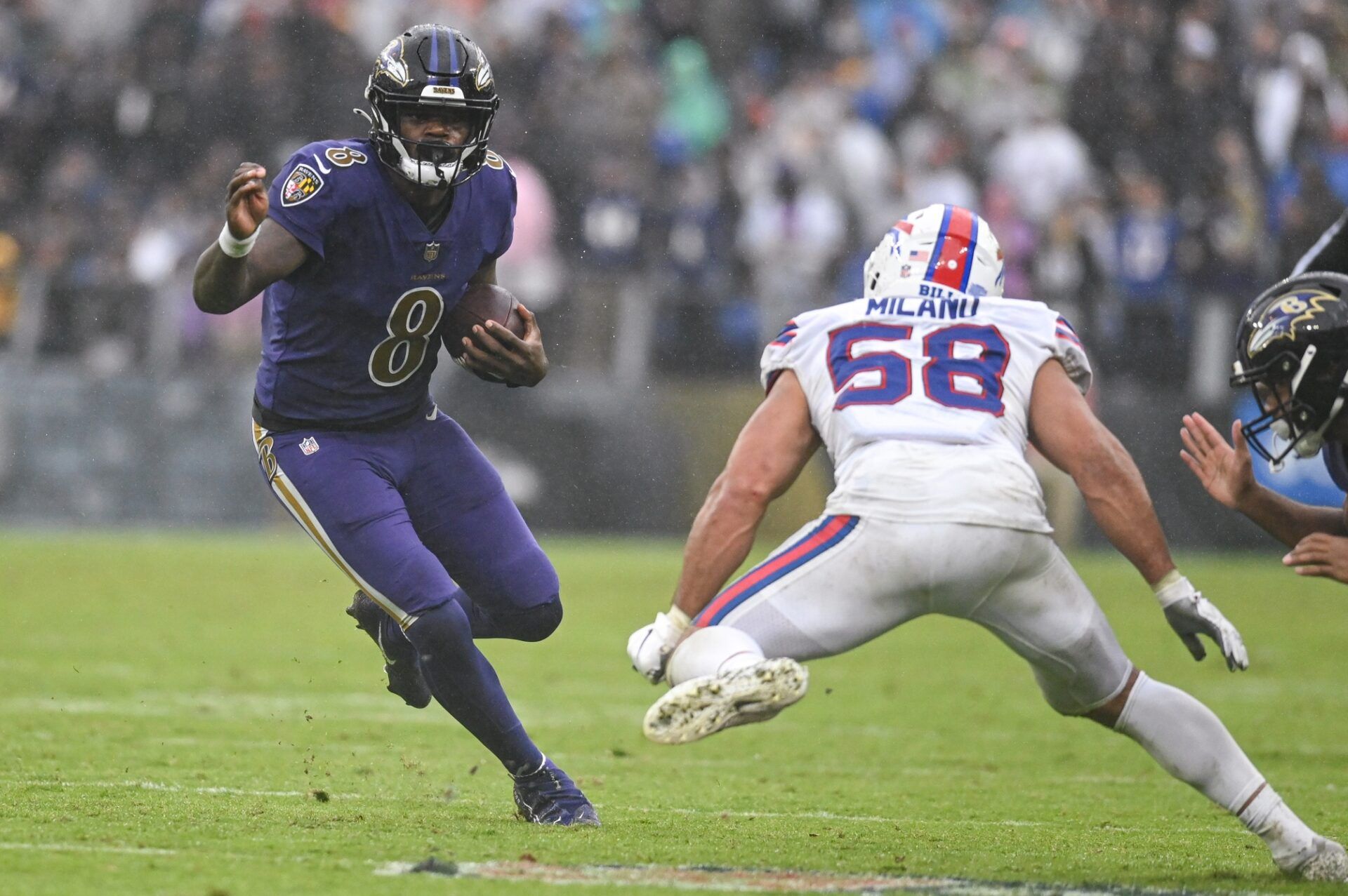 Baltimore Ravens QB Lamar Jackson (8) rushes the ball against the Buffalo Bills.