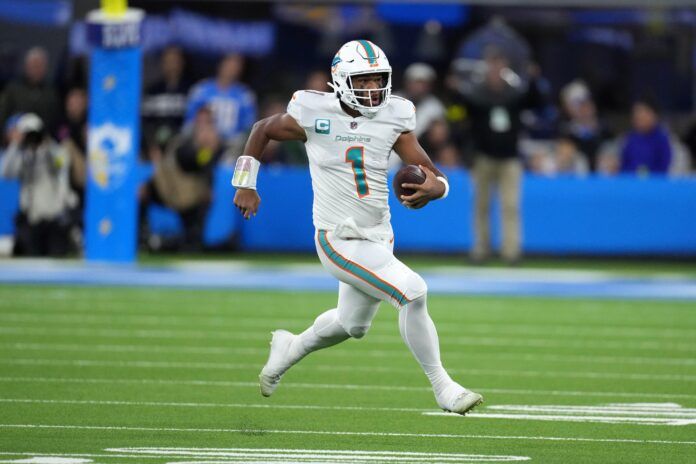 Miami Dolphins QB Tua Tagovailoa (1) takes off running against the Los Angeles Chargers.