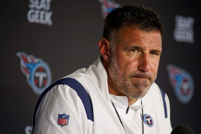 Tennessee Titans head coach Mike Vrabel sitting in during a press conference.