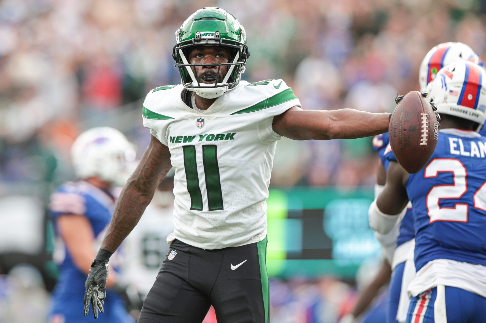 New York Jets WR Denzel Mims (11) reacts after a catch against the Buffalo Bills.