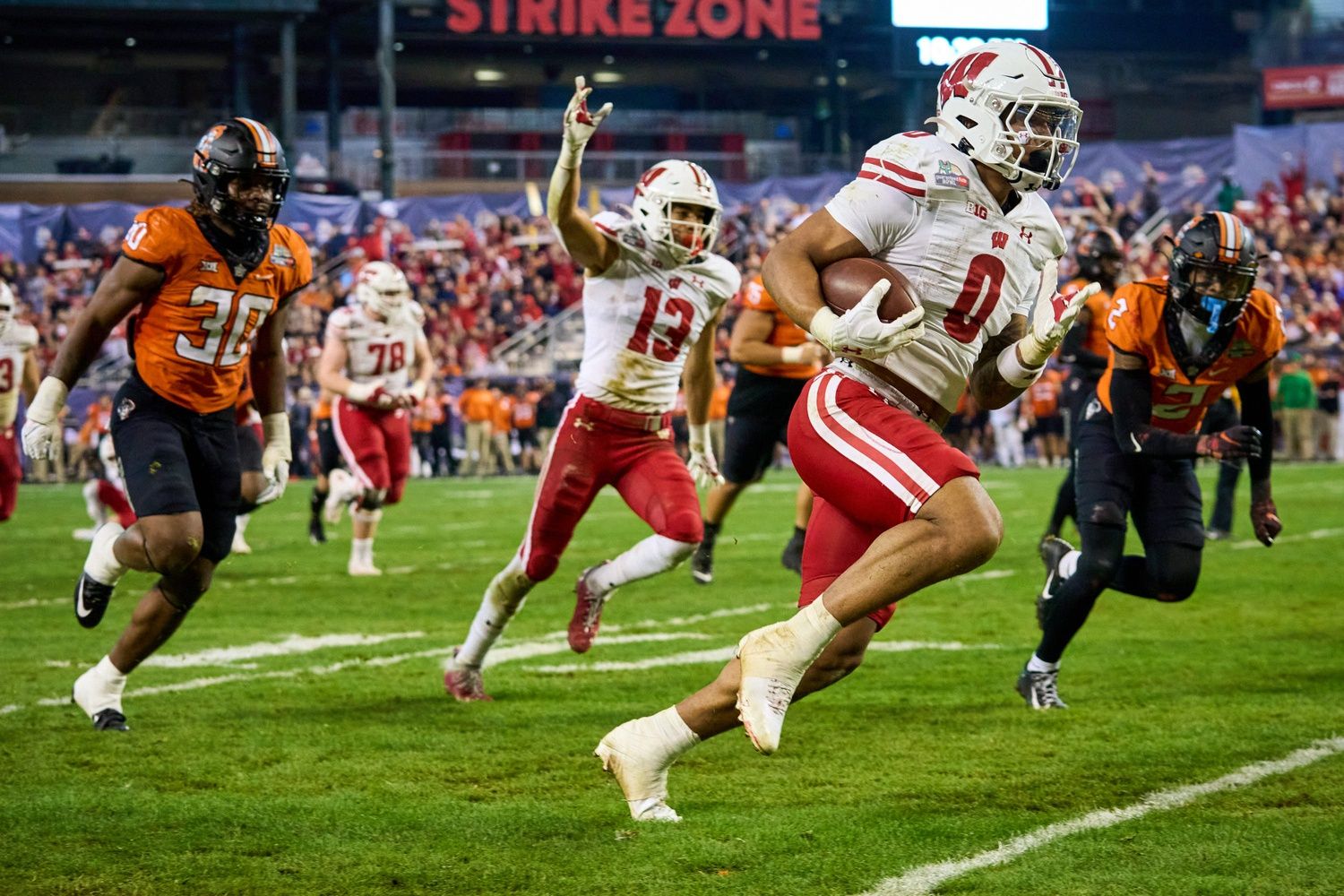 Wisconsin Badgers RB Braelon Allen (0) rushes to the end zone against the Oklahoma State Cowboys.