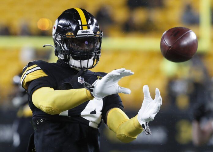 George Pickens (14) warms up before the game against the Las Vegas Raiders at Acrisure Stadium.