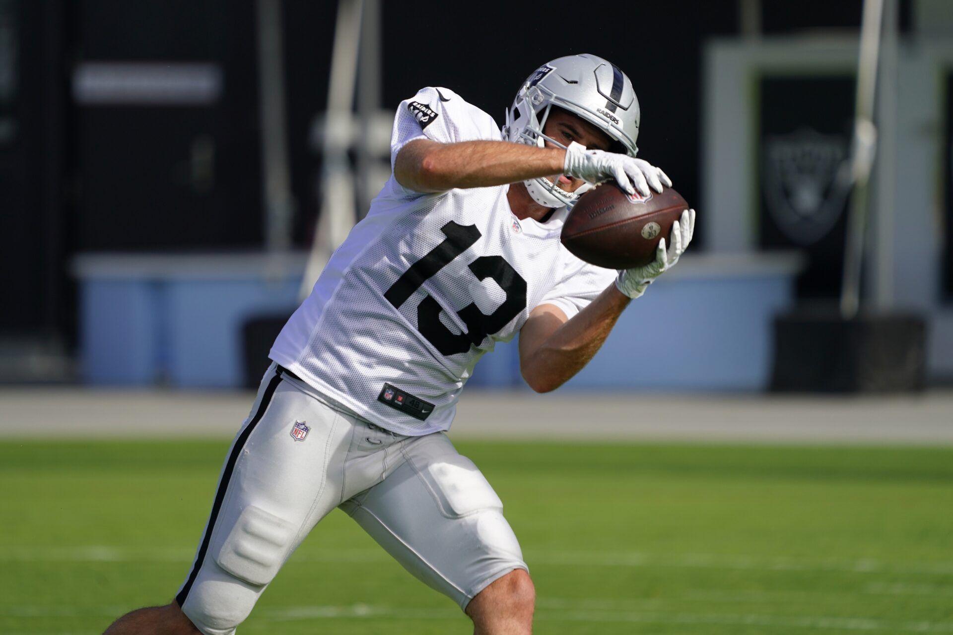 Hunter Renfrow (13) catches the ball during training camp at Intermountain Healthcare Performance Center.