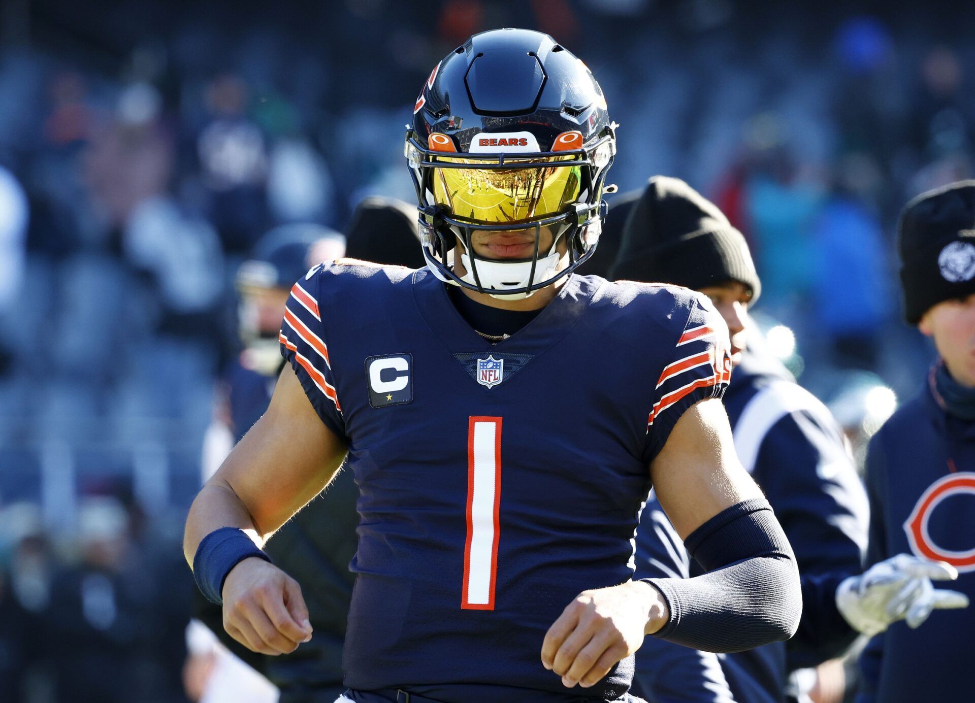 Justin Fields (1) practices before the game against the Philadelphia Eagles at Soldier Field.