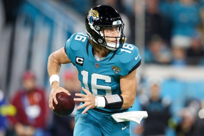 Jacksonville Jaguars QB Trevor Lawrence (16) rolls out to pass against the Tennessee Titans.