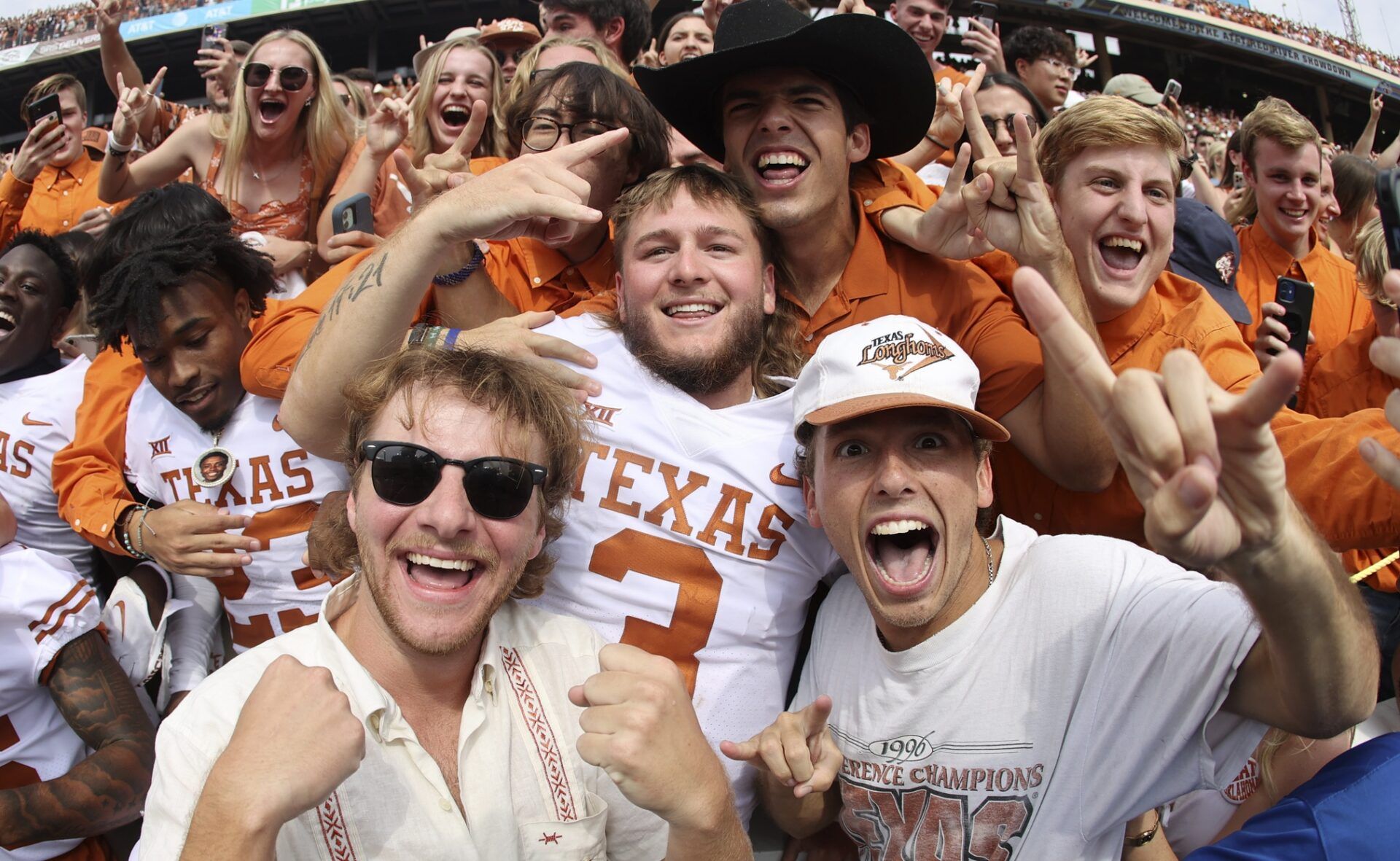 Quinn Ewers (3) celebrates with fans after the game against the Oklahoma Sooners at the Cotton Bowl.