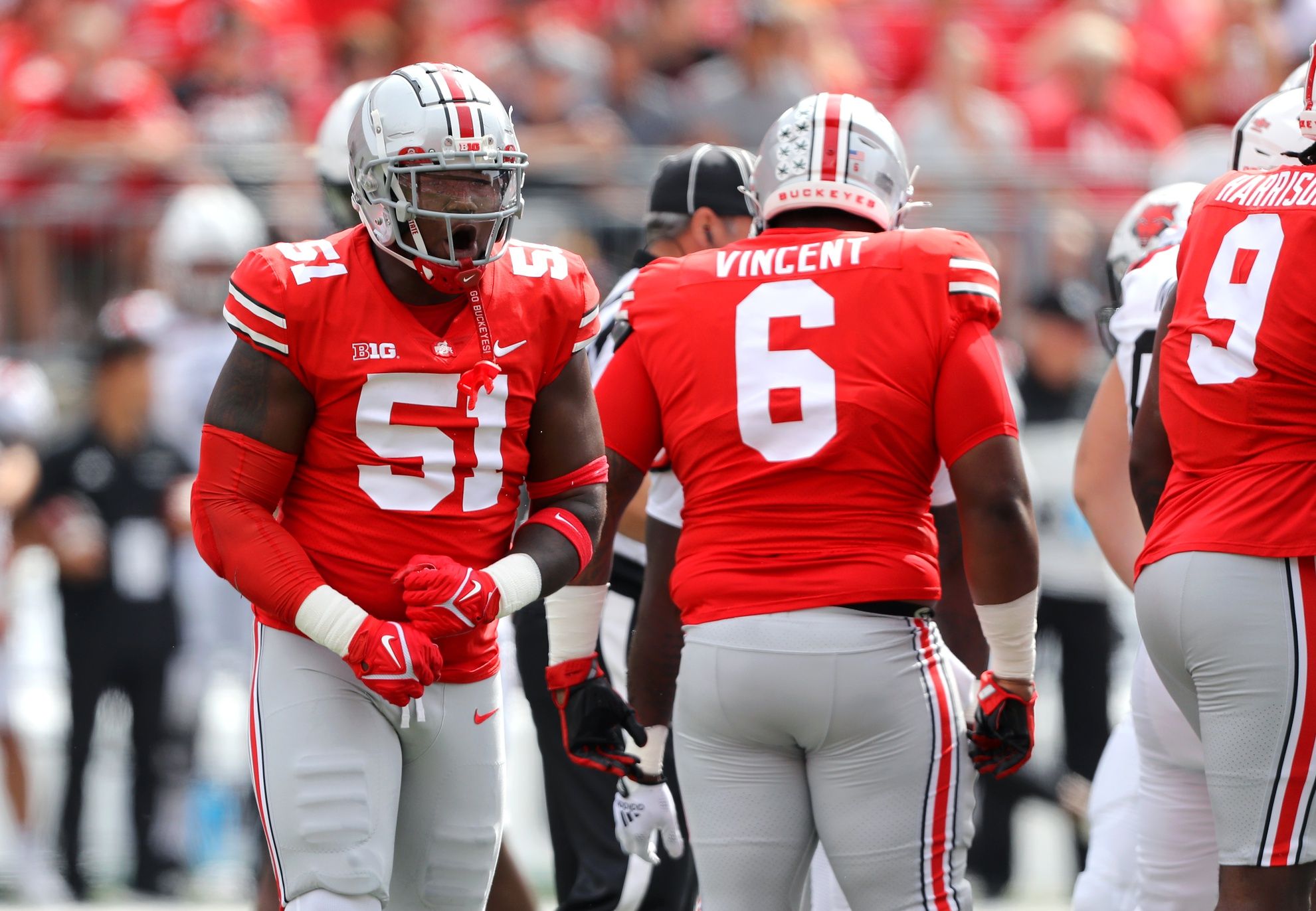 Michael Hall Jr. (51) celebrates the tackle for loss during the first quarter against the Arkansas State Red Wolves at Ohio Stadium.