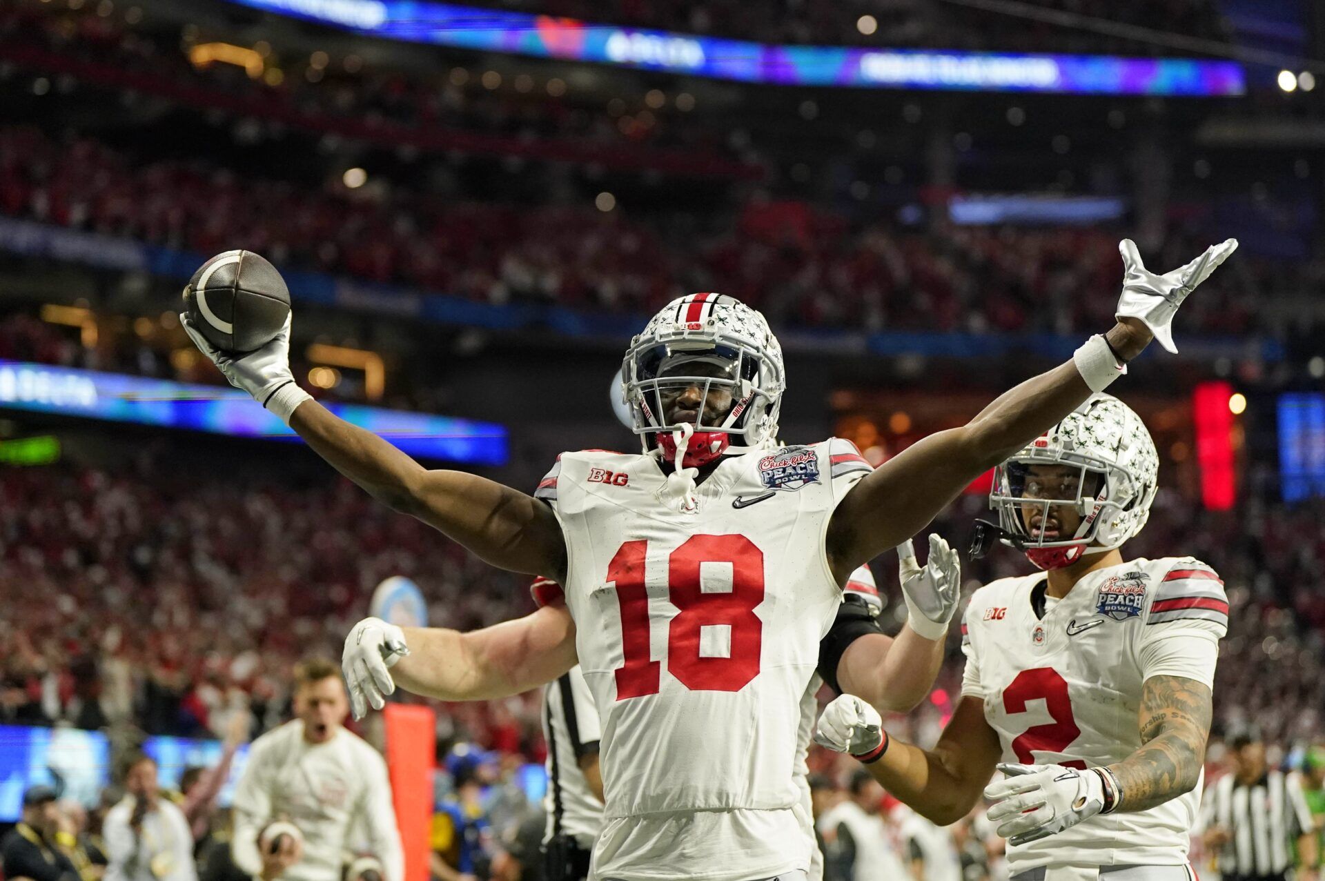 Marvin Harrison Jr. (18) reacts after scoring a touchdown against the Georgia Bulldogs during the second quarter of the 2022 Peach Bowl at Mercedes-Benz Stadium.