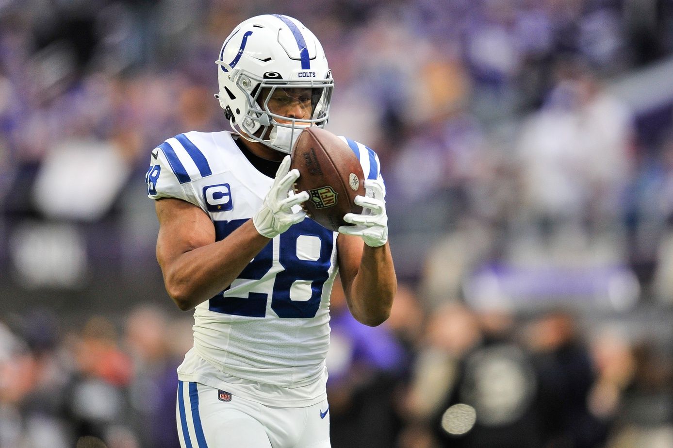 Indianapolis Colts running back Jonathan Taylor (28) warms up before the game.