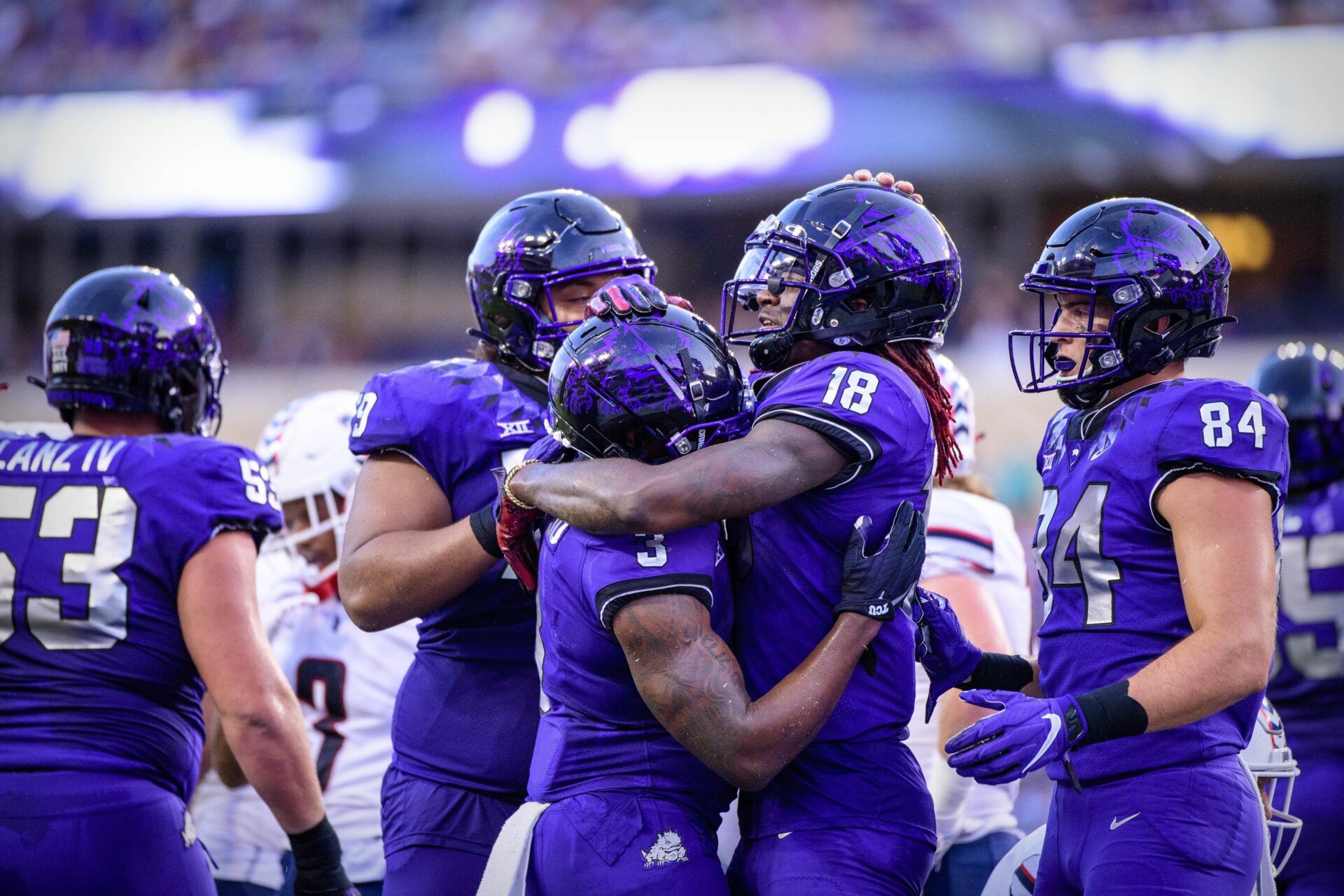 Emari Demercado (3) and wide receiver Savion Williams (18) and tight end Dominic DiNunzio (84) celebrate a touchdown against the Duquesne Dukes.