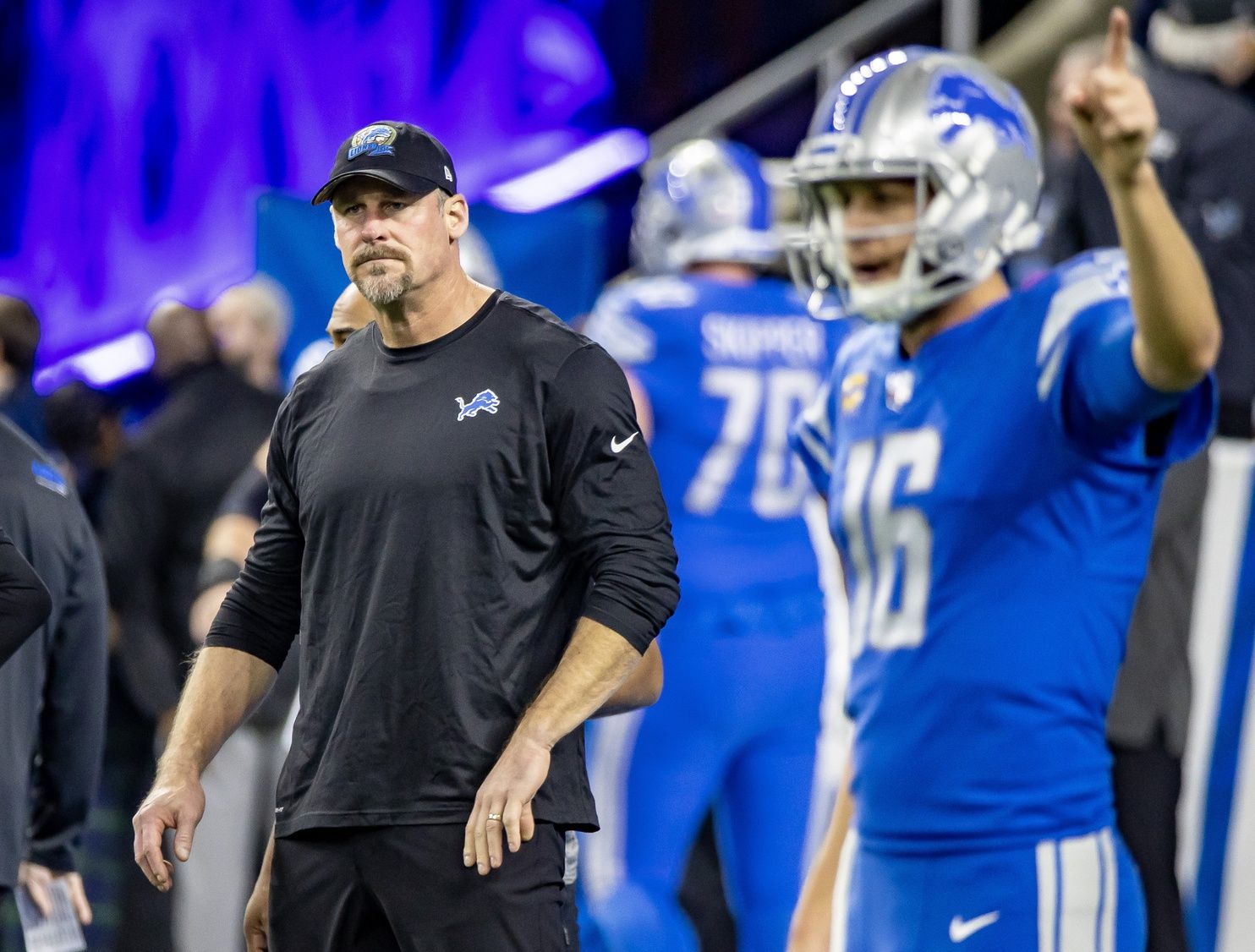 Dan Campbell walks around during warm ups before a game against the Minnesota Vikings at Ford Field.