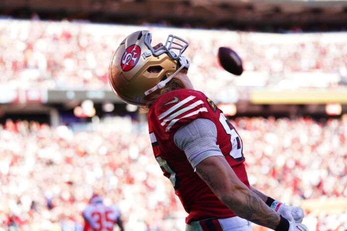 George Kittle (85) reacts after catching a touchdown pass against the Kansas City Chiefs in the fourth quarter at Levi's Stadium.