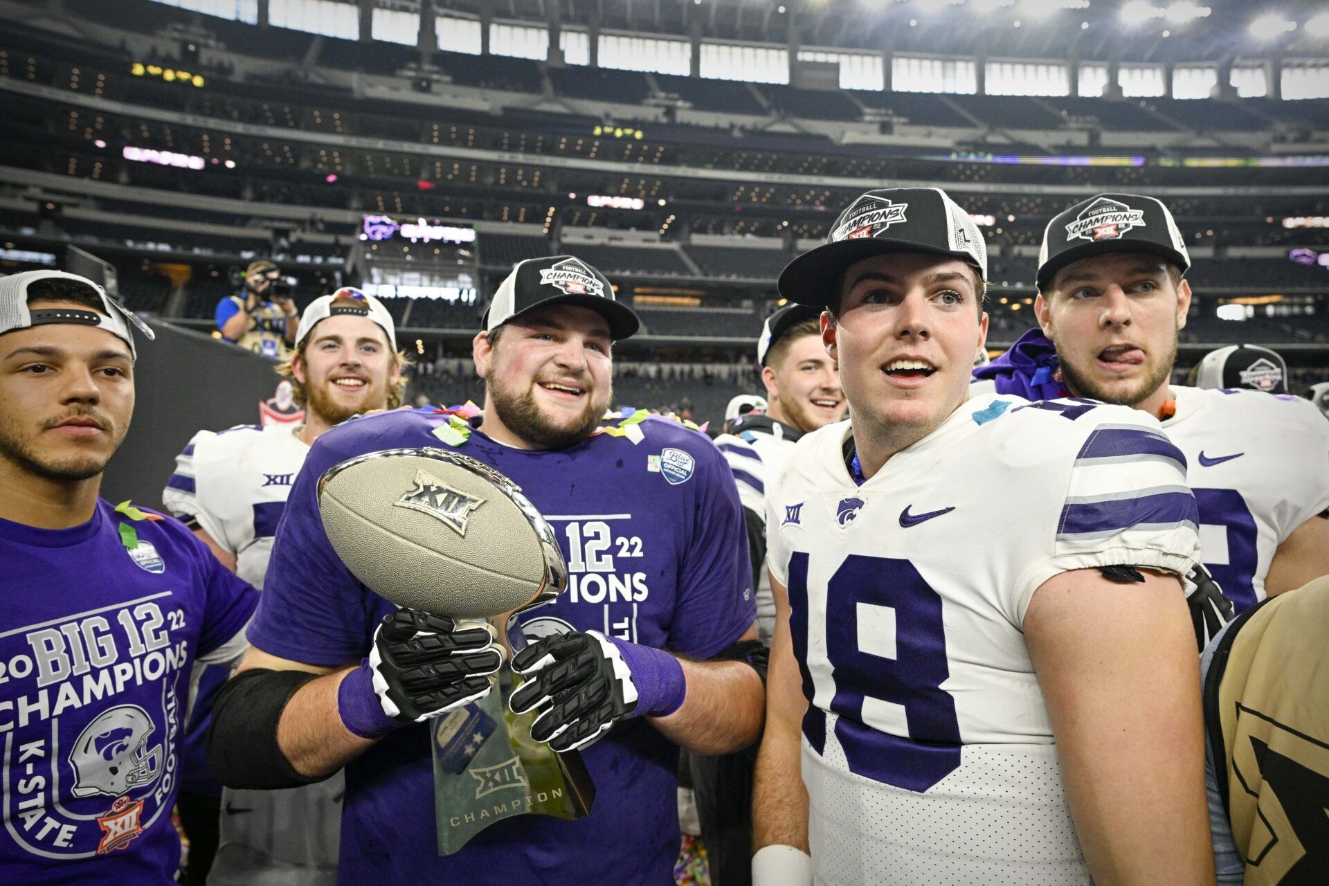 Will Howard (18) and his teammates celebrate winning the Big 12 championship after defeating the TCU Horned Frogs in overtime at AT&T Stadium.