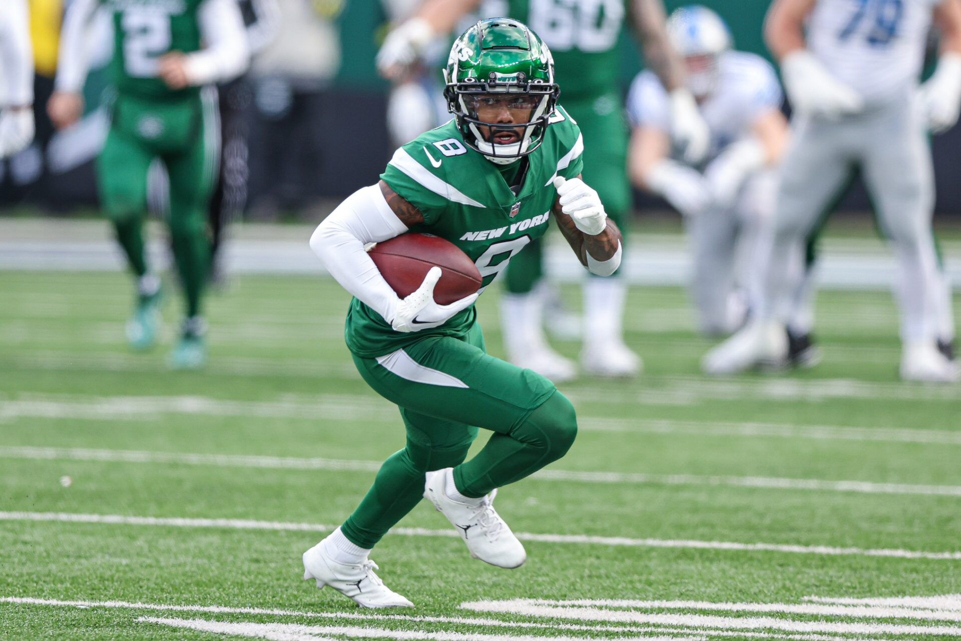 Elijah Moore (8) gains yards after the catch during the first half against the Detroit Lions at MetLife Stadium.