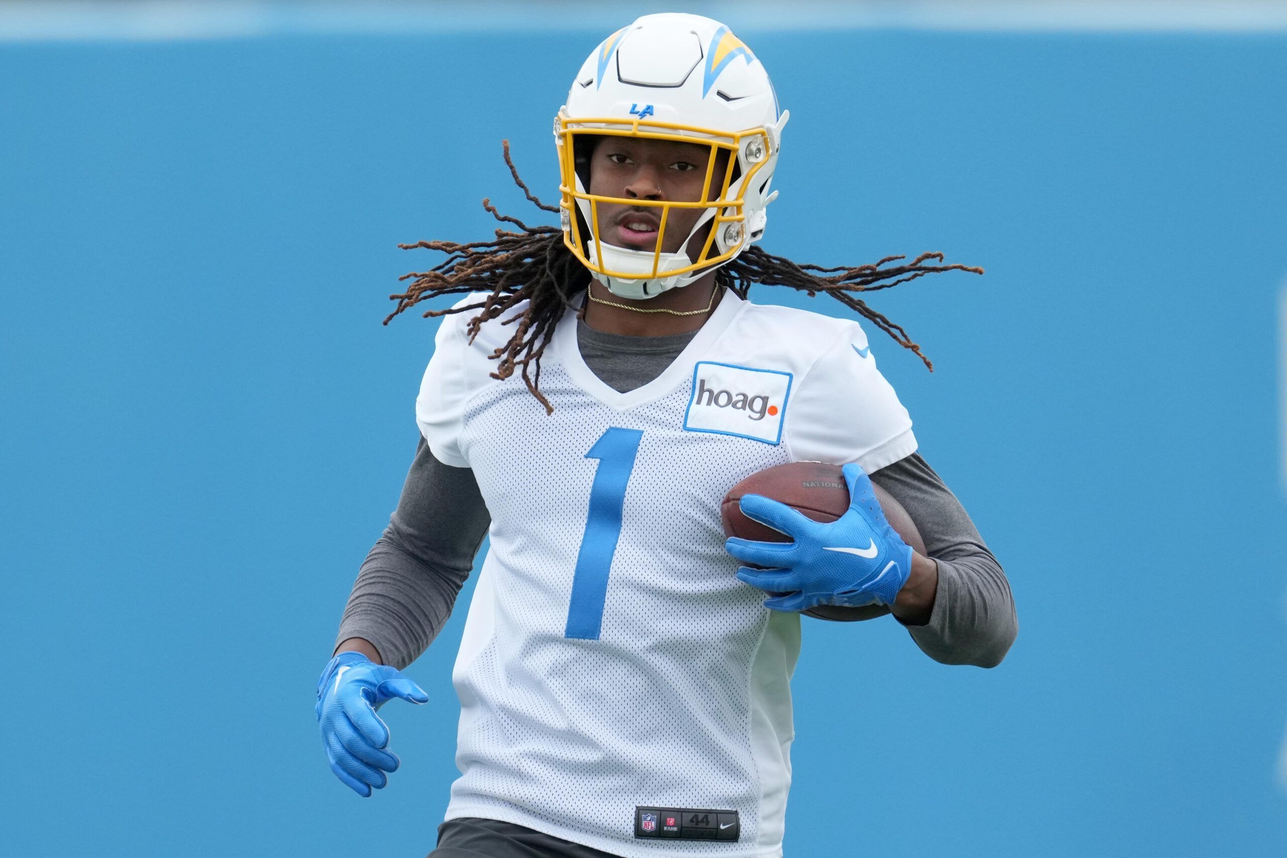 Quentin Johnston (1) carries the ball duirng minicamp at the Hoag Performance Center.