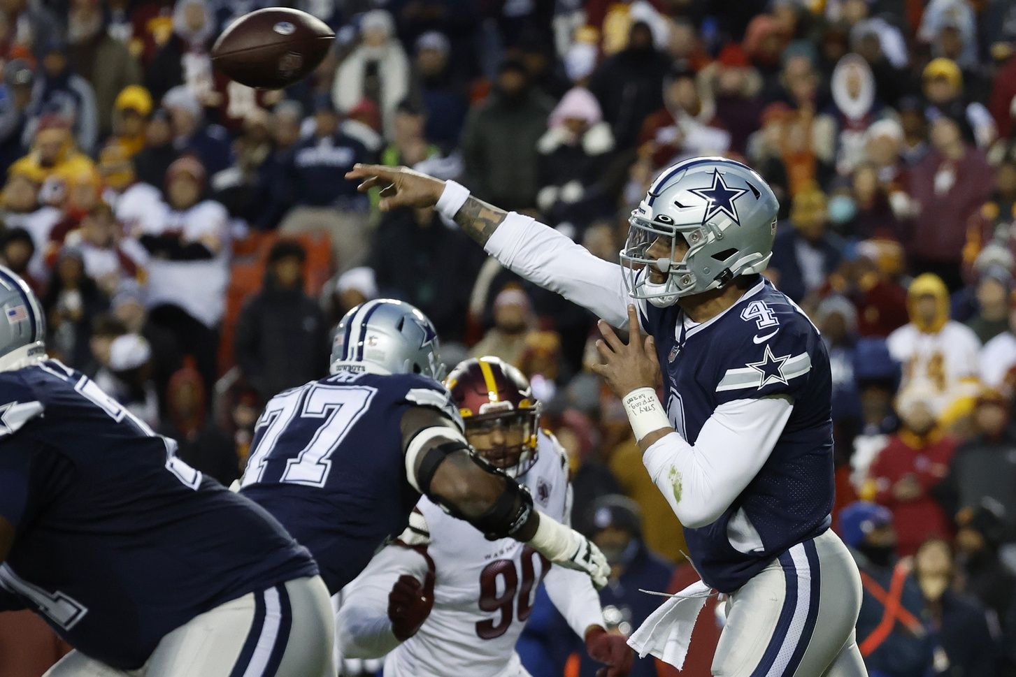 Dak Prescott (4) passes the ball against the Washington Commanders at FedExField.