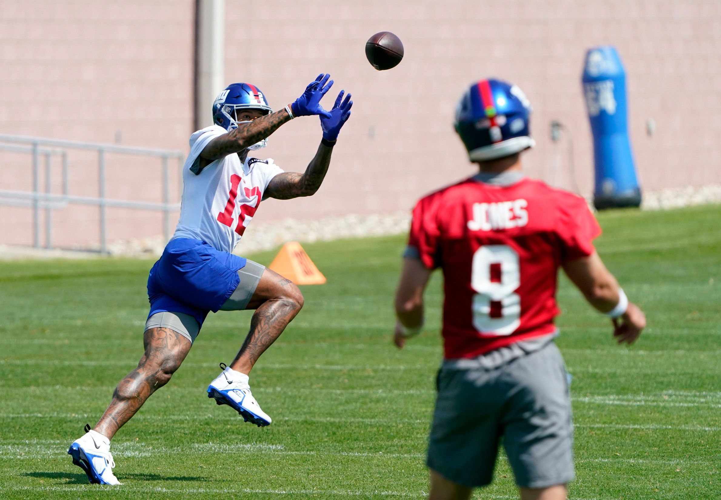 Daniel Jones (8) throws to wide receiver Darren Waller (12) during organized team activities (OTA's) at the Giants training center.