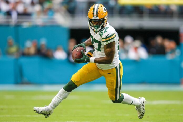 Romeo Doubs (87) runs with the football during the fourth quarter against the Miami Dolphins at Hard Rock Stadium.