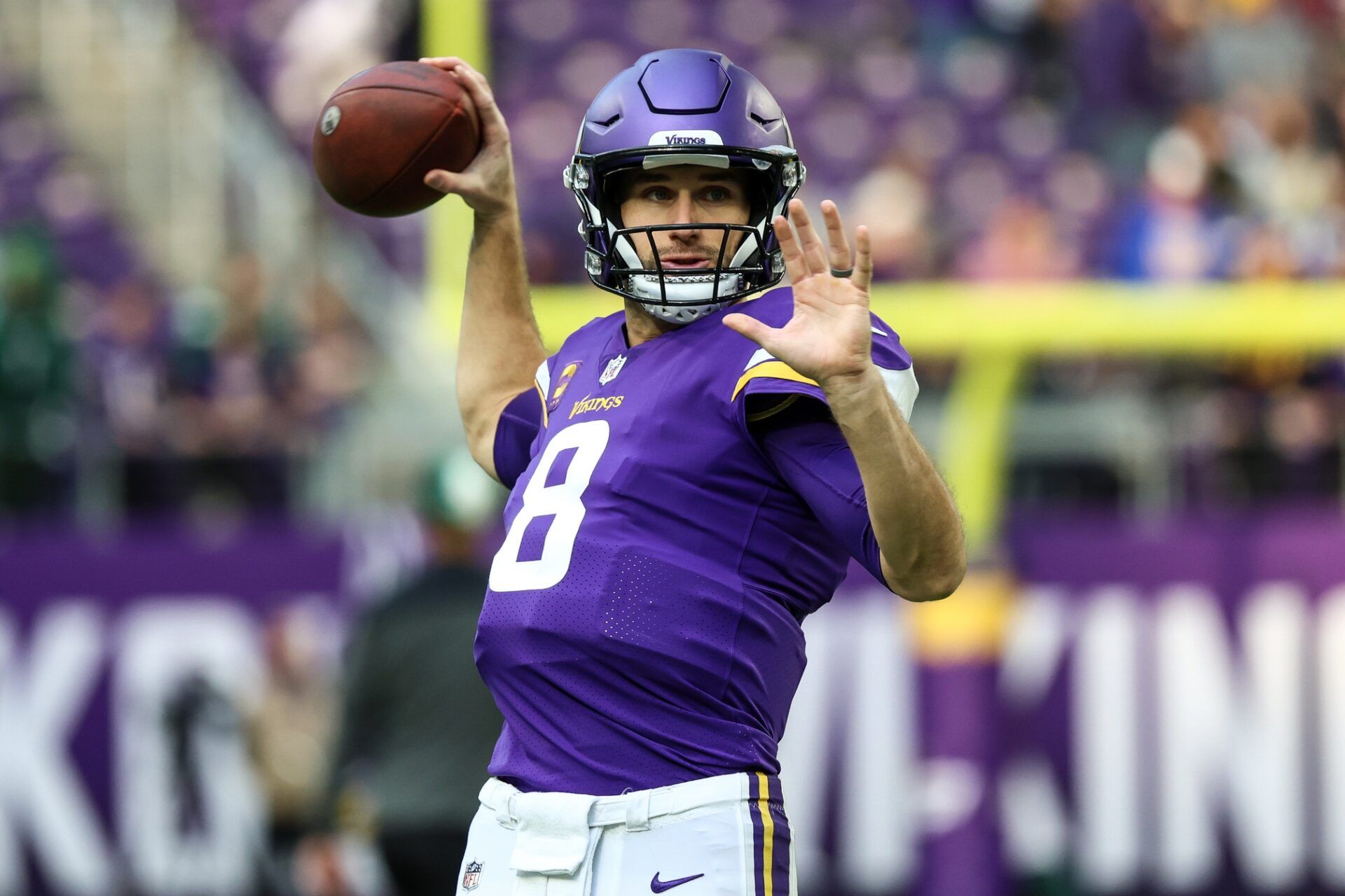 Kirk Cousins (8) warms up before the game against the New York Jets at U.S. Bank Stadium.