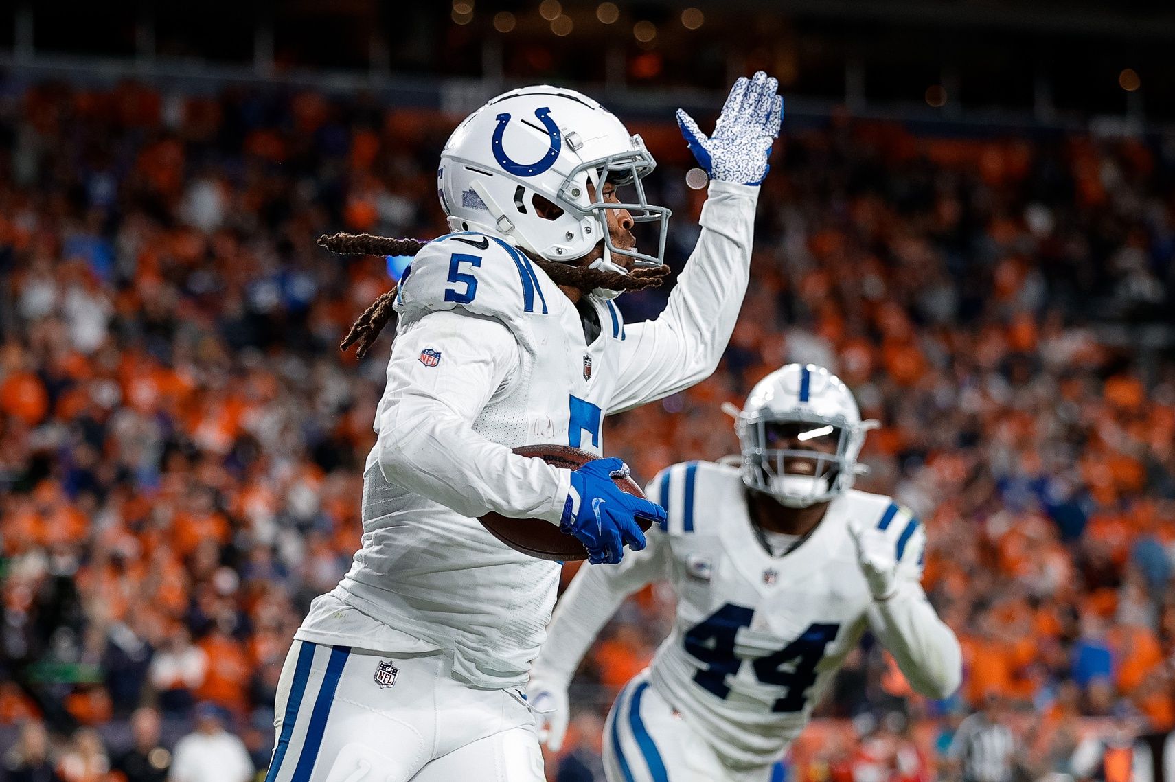 Stephon Gilmore (5) reacts after an interception in the fourth quarter against the Denver Broncos at Empower Field at Mile High.