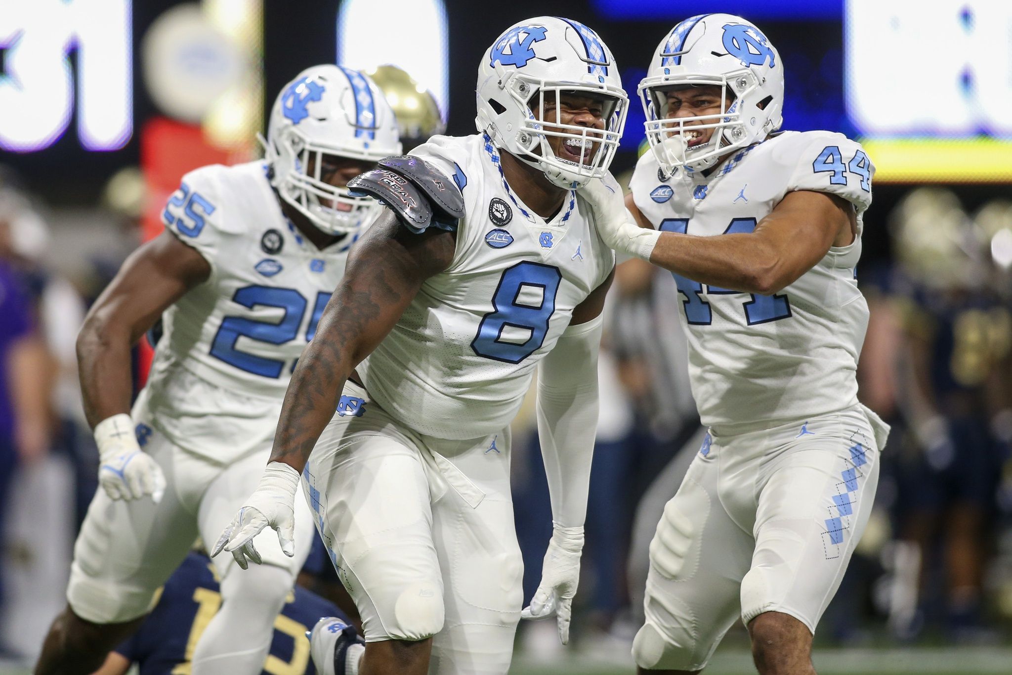 Myles Murphy (8) celebrates after a sack with linebacker Jeremiah Gemmel (44) against the Georgia Tech Yellow Jackets in the first quarter at Mercedes-Benz Stadium.