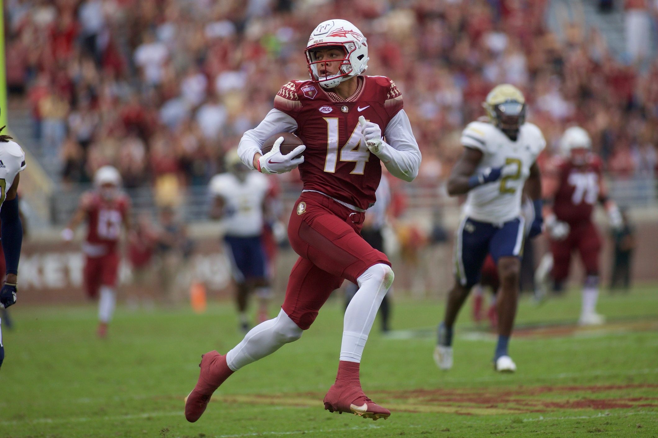 Johnny Wilson (14) rushes toward the end zone. Florida State football defeated Georgia Tech, 41-16, On Oct. 29, 2022, at Doak Campbell Stadium.