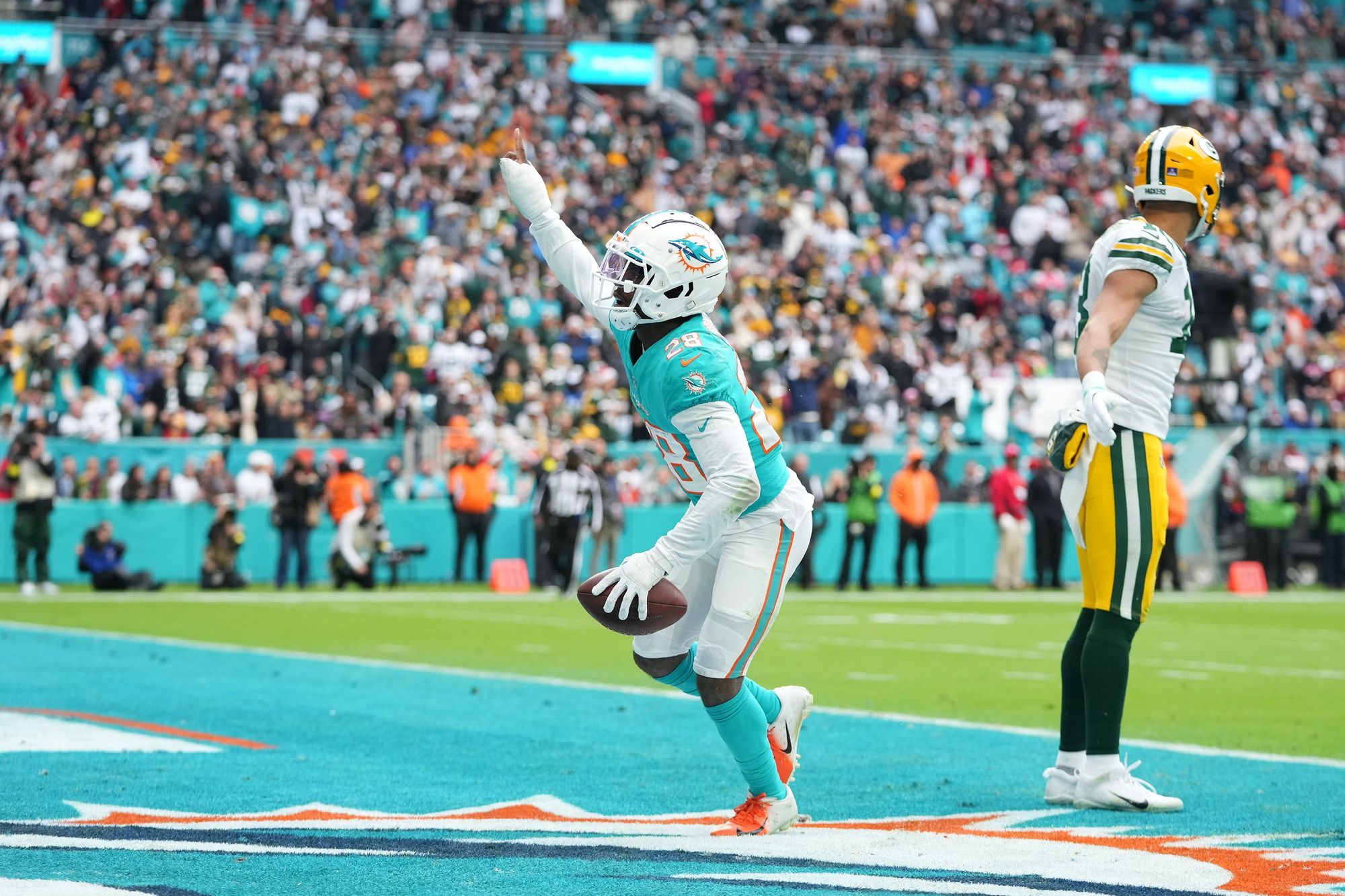 Kader Kohou (28) celebrates after intercepting a pass from Green Bay Packers quarterback Aaron Rodgers.