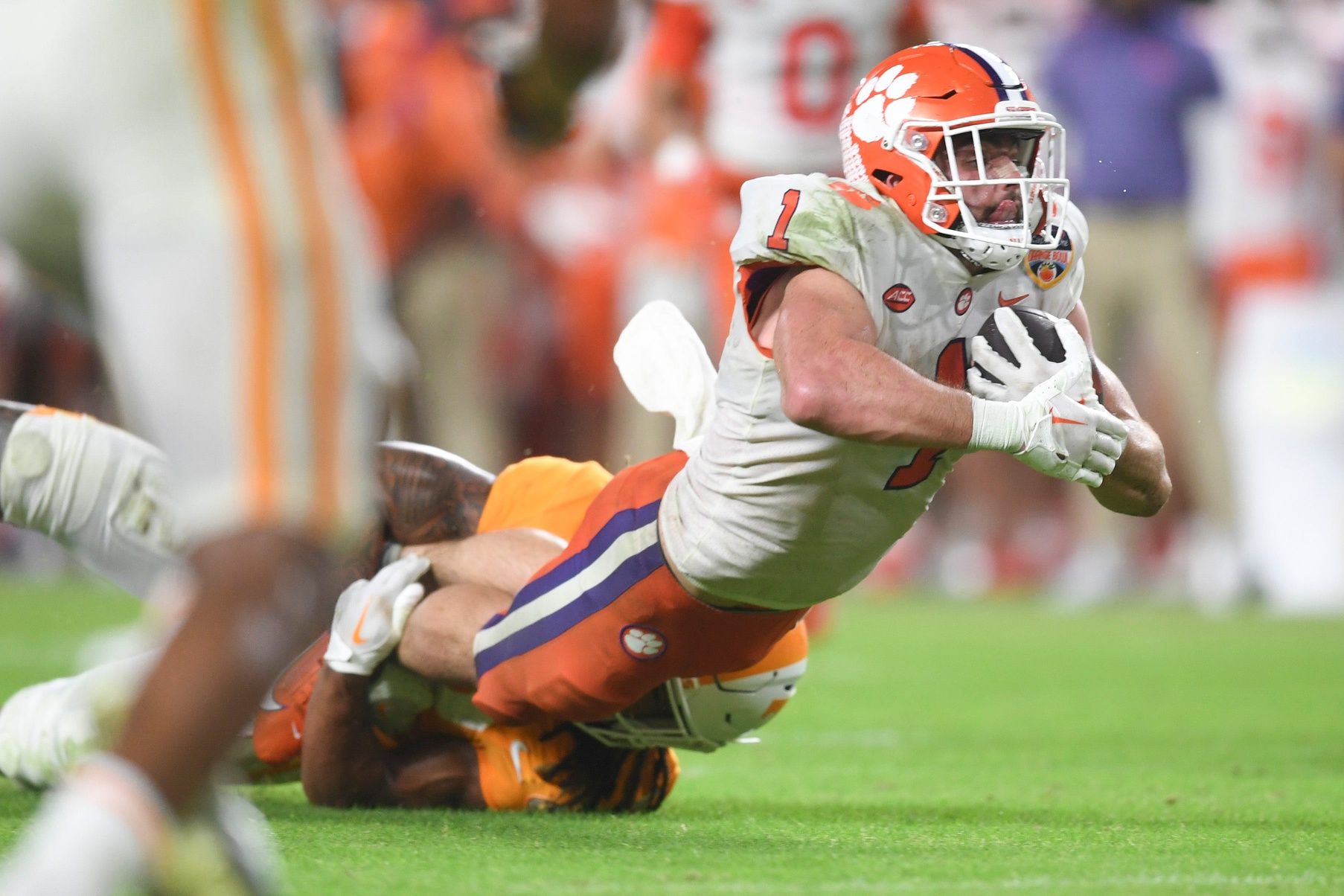 Clemson Tigers RB Will Shipley (1) gets tripped up during the Orange Bowl against the Tennessee Volunteers.