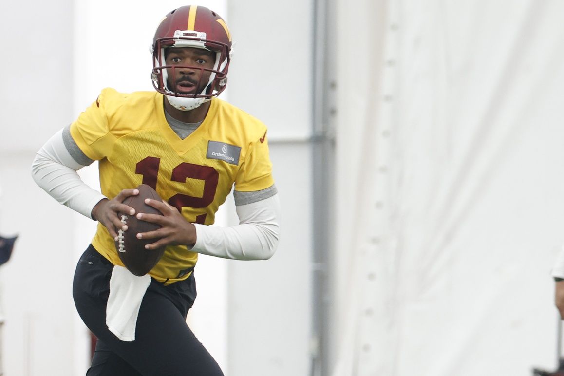 Washington Commanders QB Jacoby Brissett (12) gets ready to pass during minicamp.