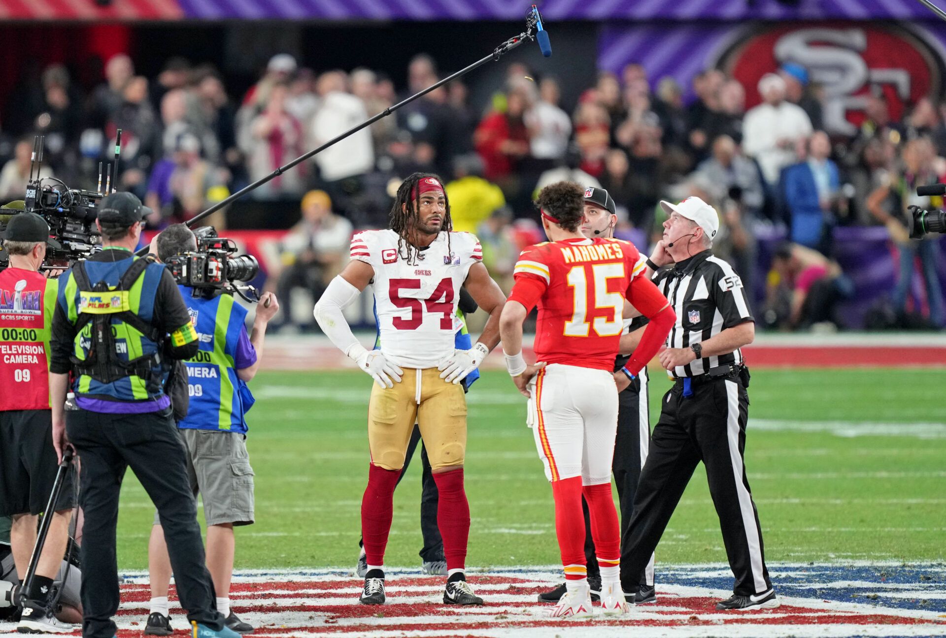 Feb 11, 2024; Paradise, Nevada, USA; San Francisco 49ers linebacker Fred Warner (54) and Kansas City Chiefs quarterback Patrick Mahomes (15) during the coin toss before overtime of Super Bowl LVIII at Allegiant Stadium. Mandatory Credit: Kyle Terada-USA TODAY Sports