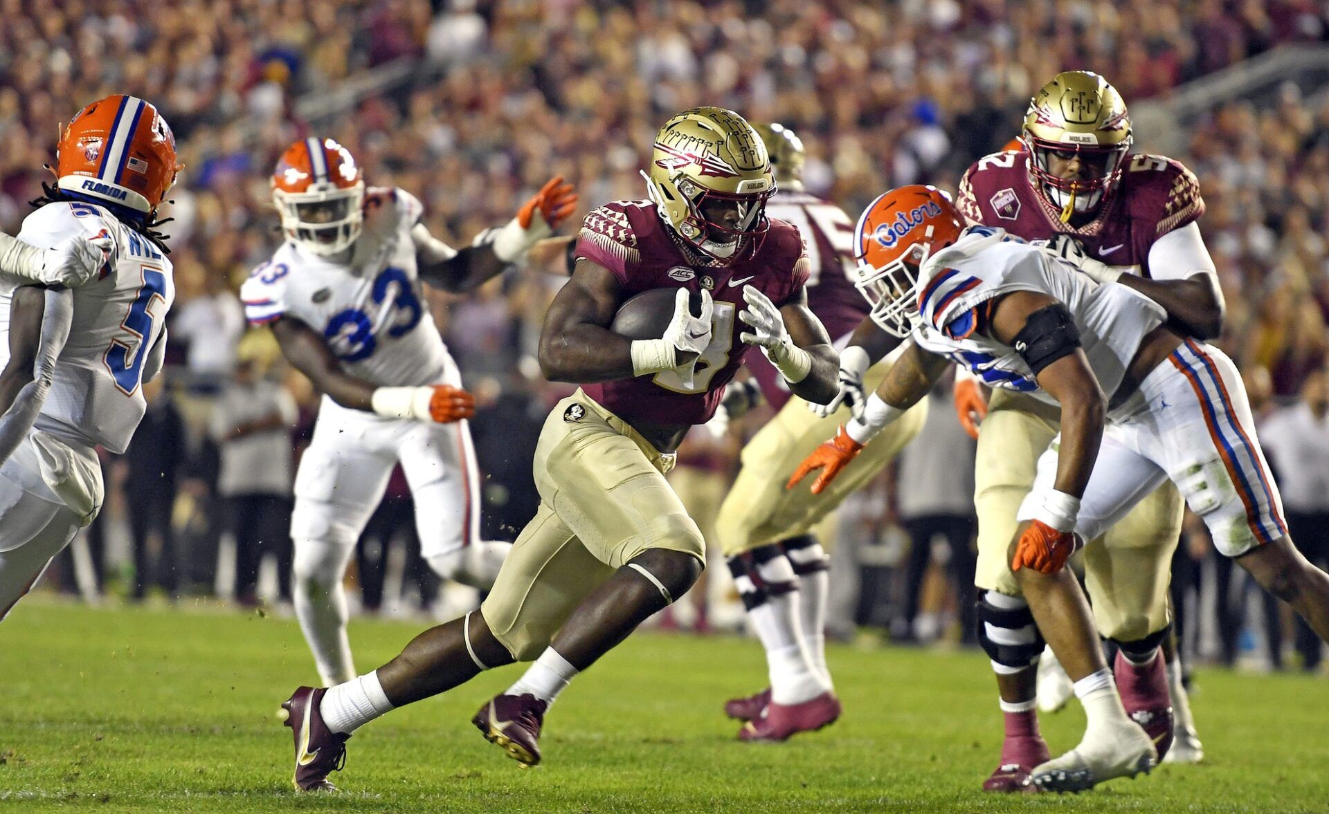 Florida State Seminoles running back Trey Benson (3) runs for a touchdown during the first quarter against the Florida Gators at Doak S. Campbell Stadium.