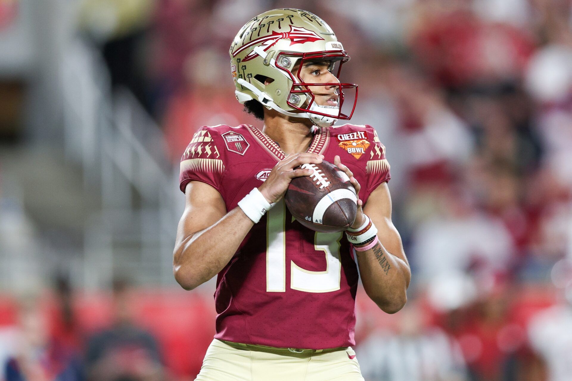 Florida State QB Jordan Travis (13) gets ready to pass.