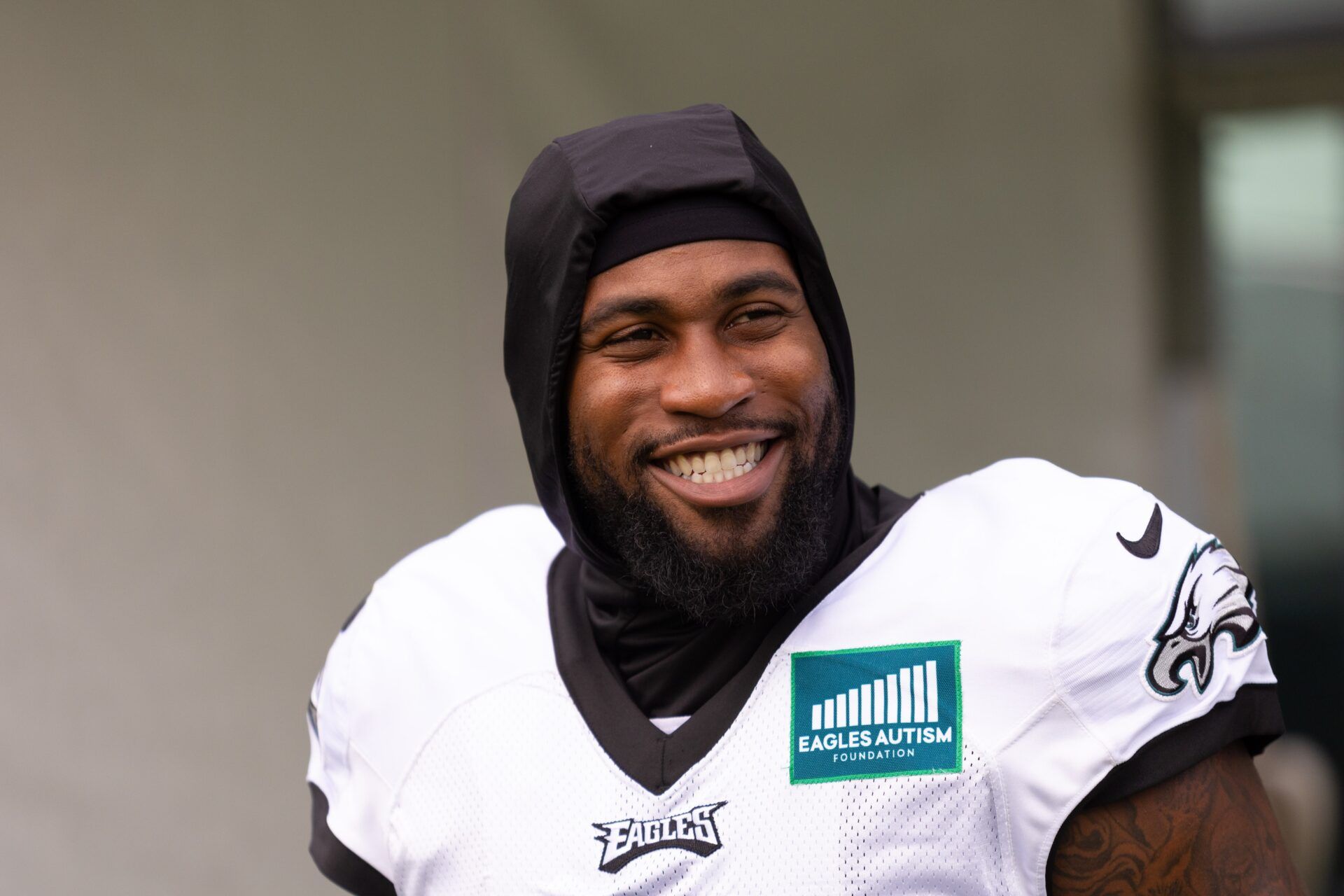 Philadelphia Eagles LB Haason Reddick smiling during practice.