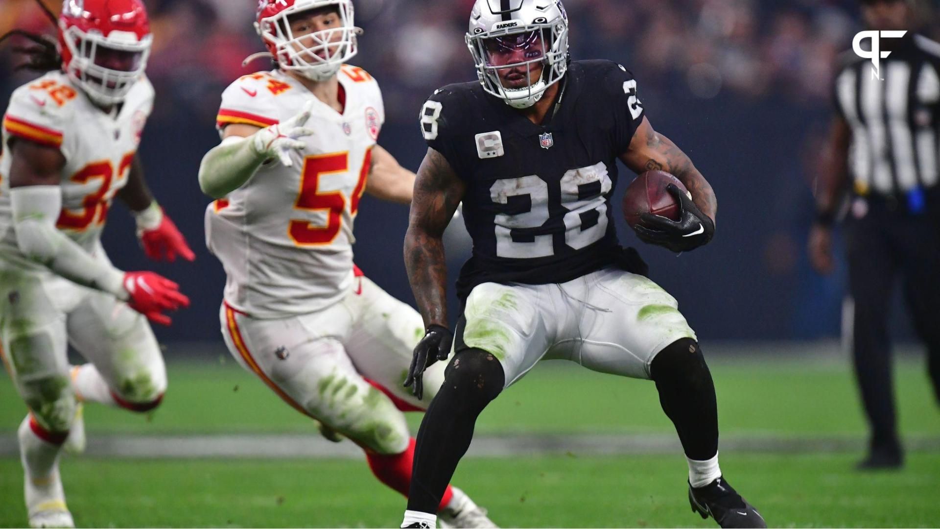 Las Vegas Raiders RB Josh Jacobs (28) runs the ball against the Kansas City Chiefs.