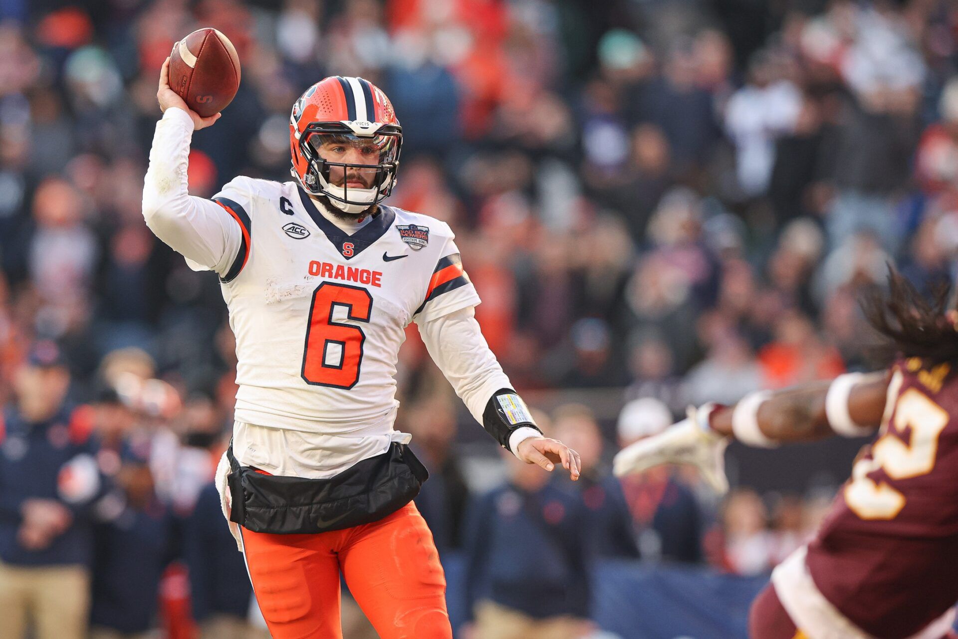 Syracuse Orange quarterback Garrett Shrader (6) fakes a throw and rushes for a touchdown during the first half of the 2022 Pinstripe Bowl against the Minnesota Golden Gophers at Yankee Stadium.