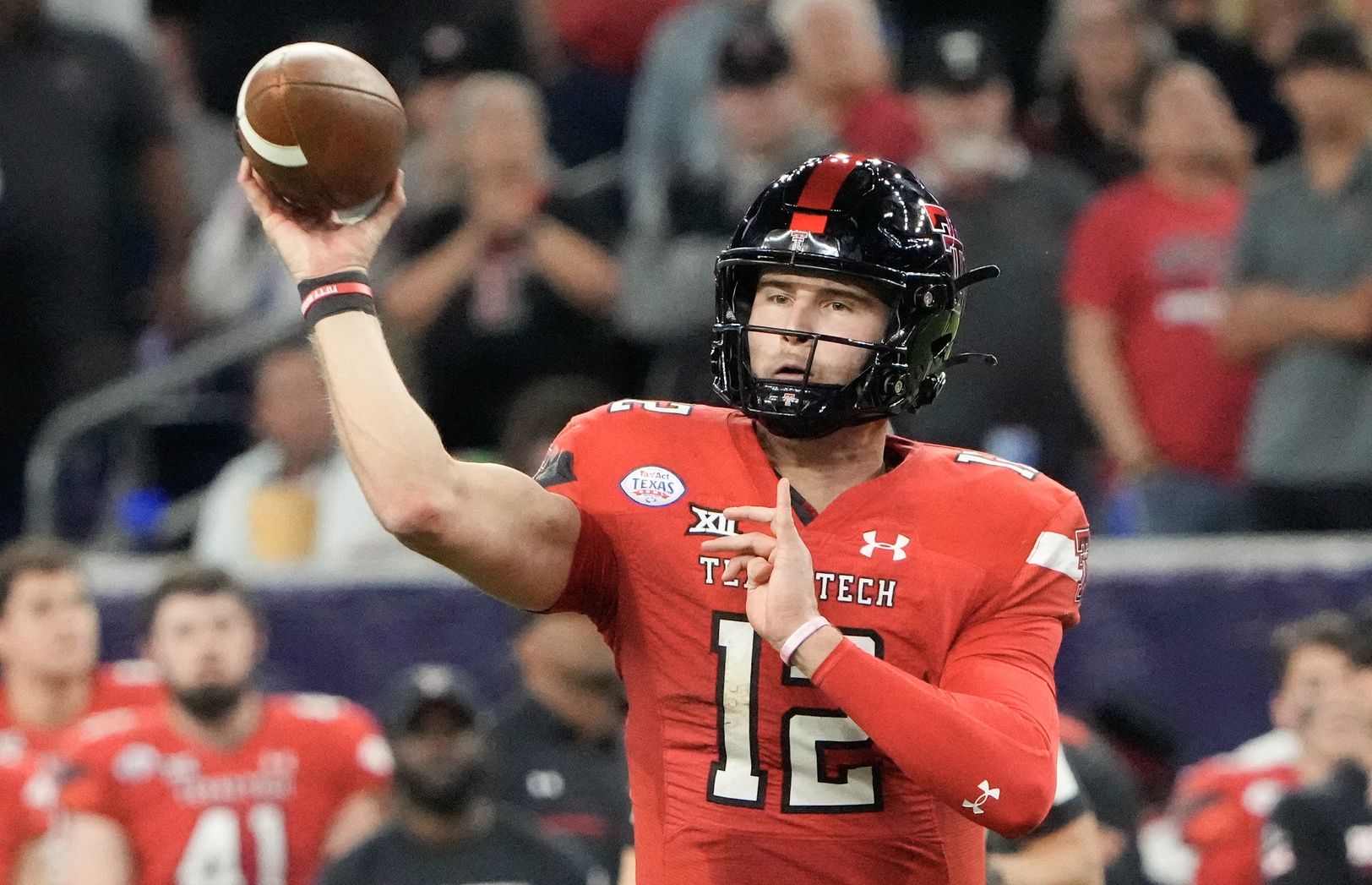 ;Texas Tech Red Raiders quarterback Tyler Shough (12) passes against the Mississippi Rebels in the first half in the 2022 Texas Bowl at NRG Stadium.