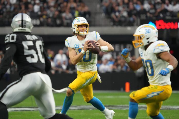 Los Angeles Chargers QB Justin Herbert (10) looks to throw against the Las Vegas Raiders.