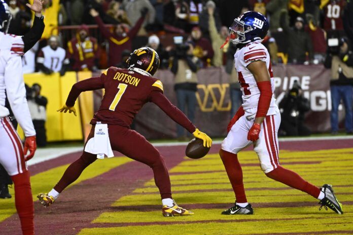 Washington Commanders WR Jahan Dotson (1) celebrates after scoring a touchdown against the New York Giants.