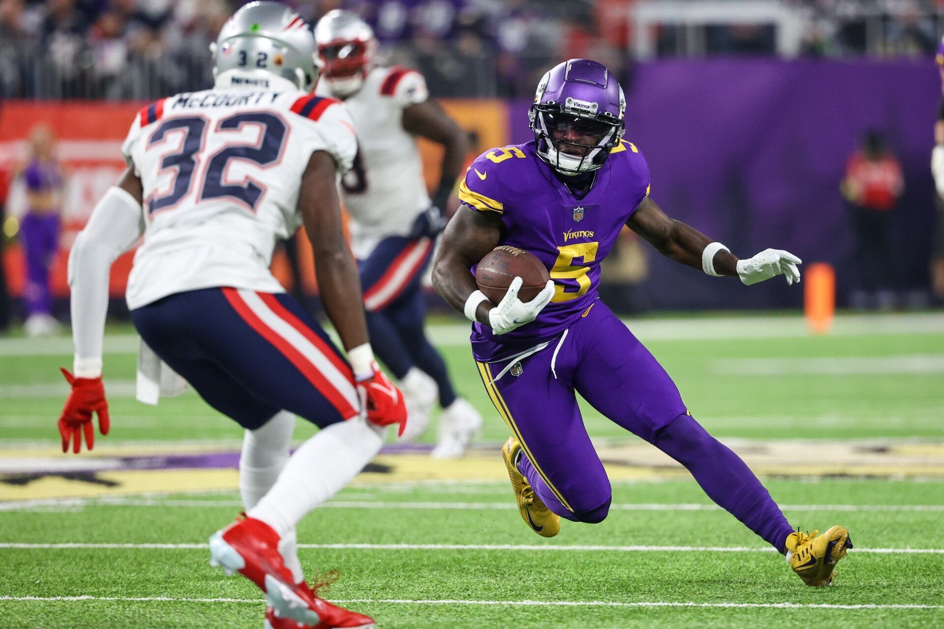 Minnesota Vikings WR Jalen Reagor (5) runs with the ball against the New England Patriots.