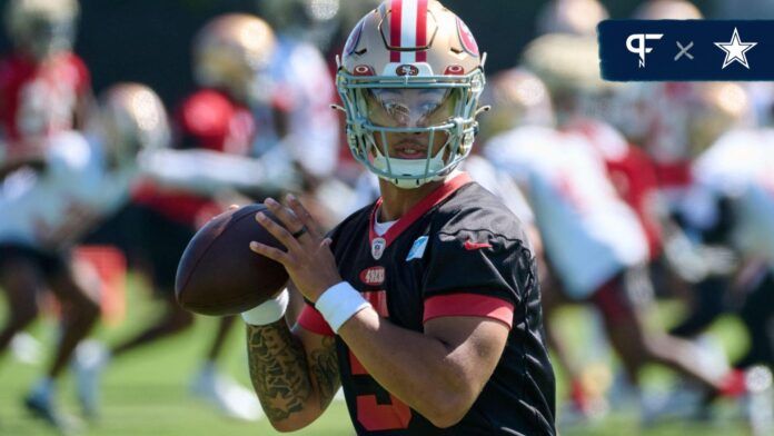 Quarterback Trey Lance practicing during training camp.