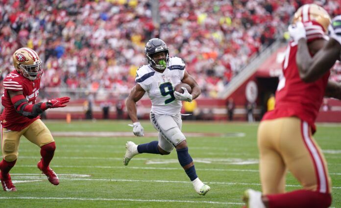 Seattle Seahawks RB Kenneth Walker III carries the football.