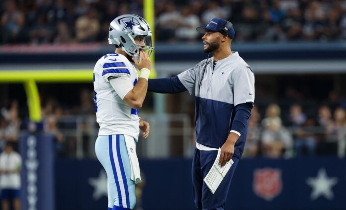 Dallas Cowboys QBs Dak Prescott and Will Grier speak during preseason game.