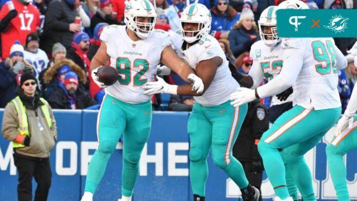 Miami Dolphins DL Zach Sieler (92) celebrates with teammates after recovering a fumble for a TD against the Buffalo Bills.