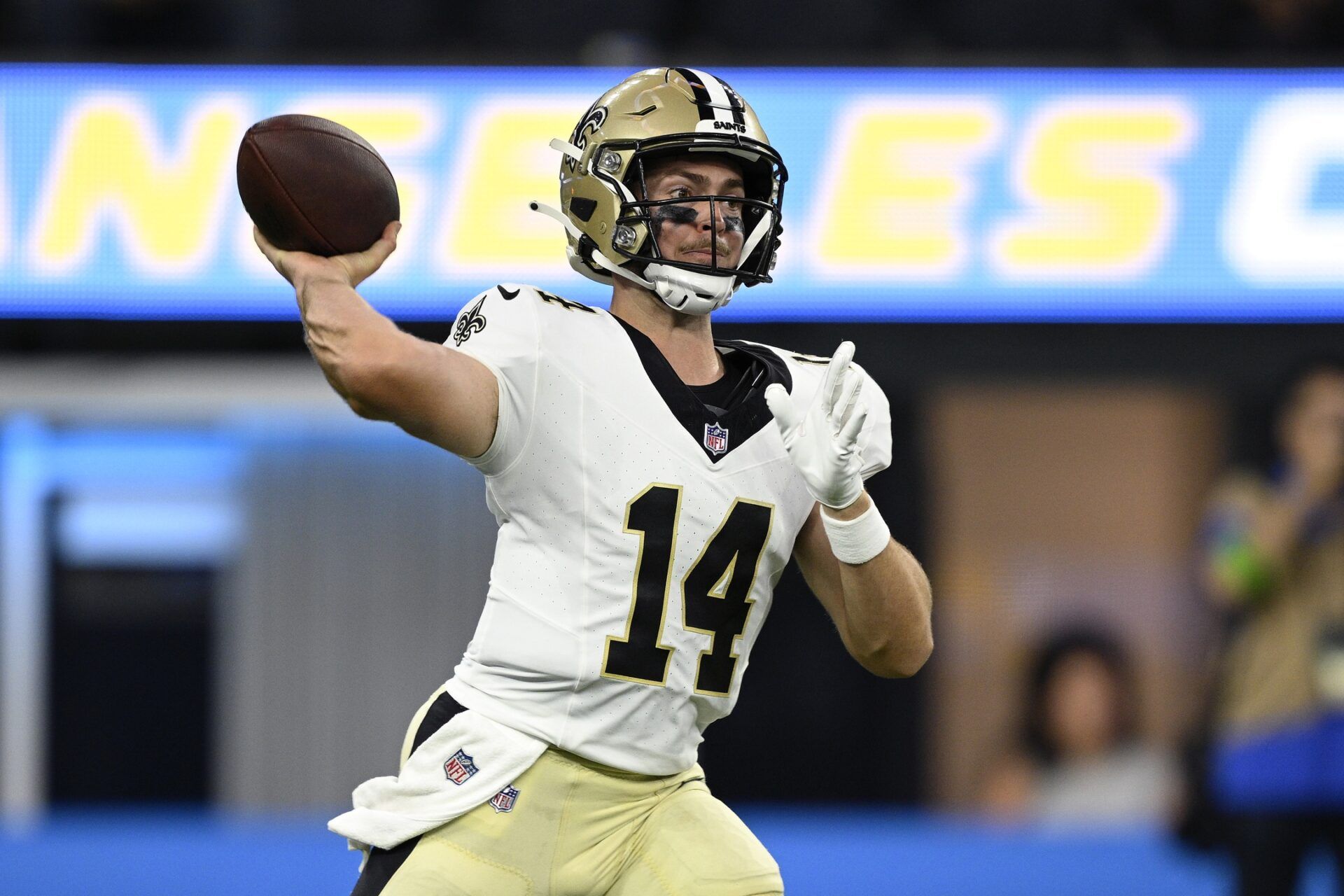 New Orleans Saints QB Jake Haener (14) throws a pass against the Los Angeles Chargers in a preseason game.