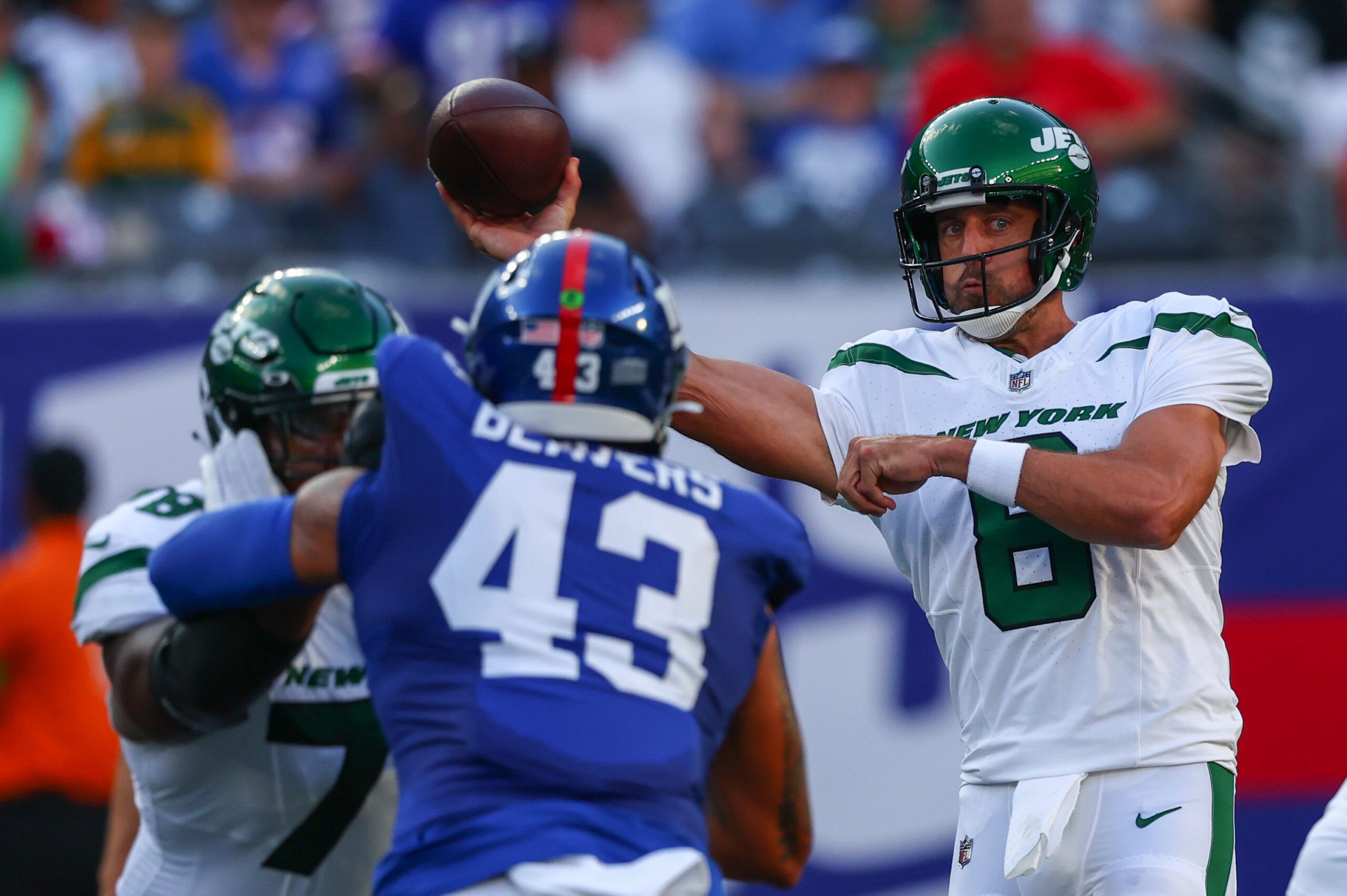 New York Jets quarterback Aaron Rodgers (8) throws a pass against the New York Giants during the first half at MetLife Stadium. Mandatory Credit: Ed Mulholland-USA TODAY Sports