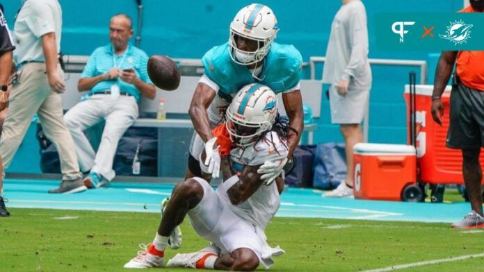 Miami Dolphins cornerback Eli Apple (33) and wide receiver Daewood Davis (87) participate during the scrimmage at Hard Rock Stadium, Saturday, August 5, 2023 in Miami Gardens.